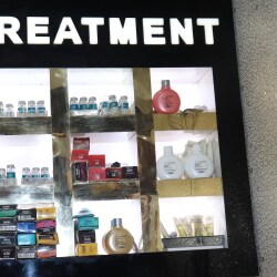 Treatment product display shelves